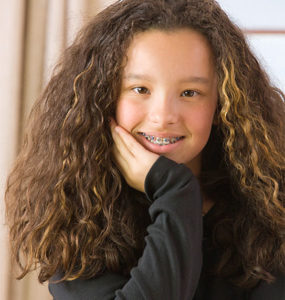 A girl with curly hair.