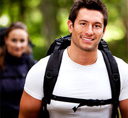 A man with a backpack and a woman with a backpack.