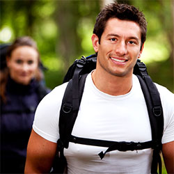 A man with a backpack and a woman with a backpack.