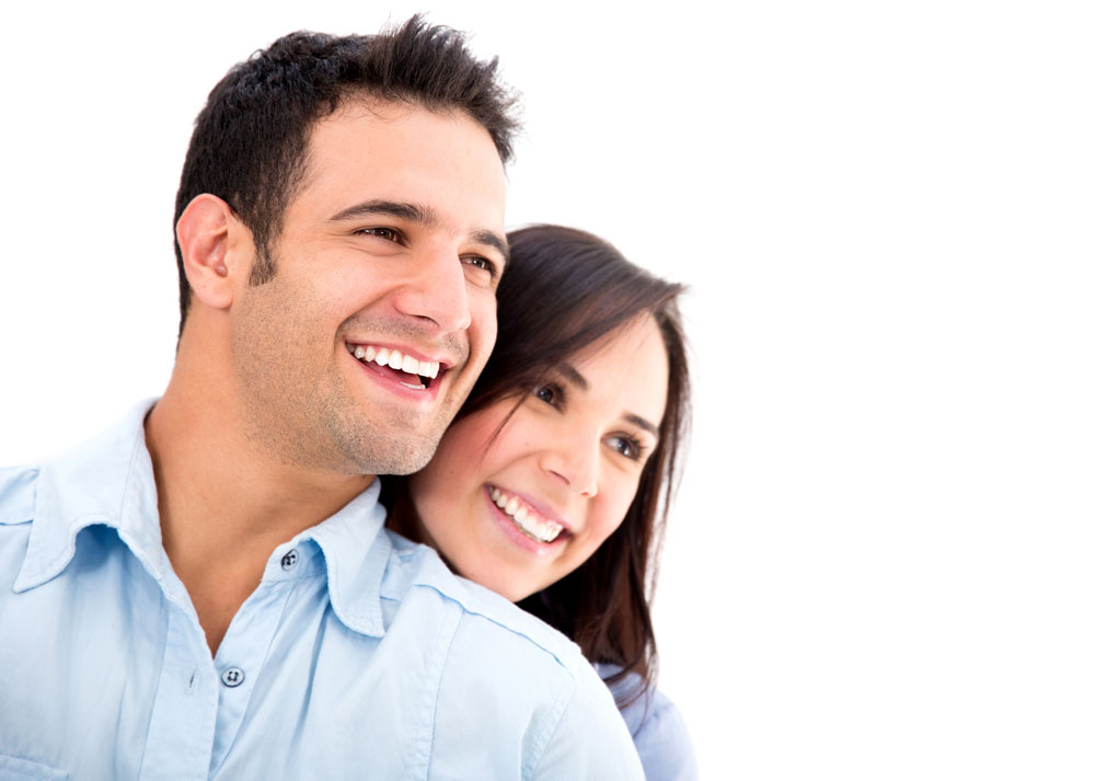 A man and a woman smiling against a white background.