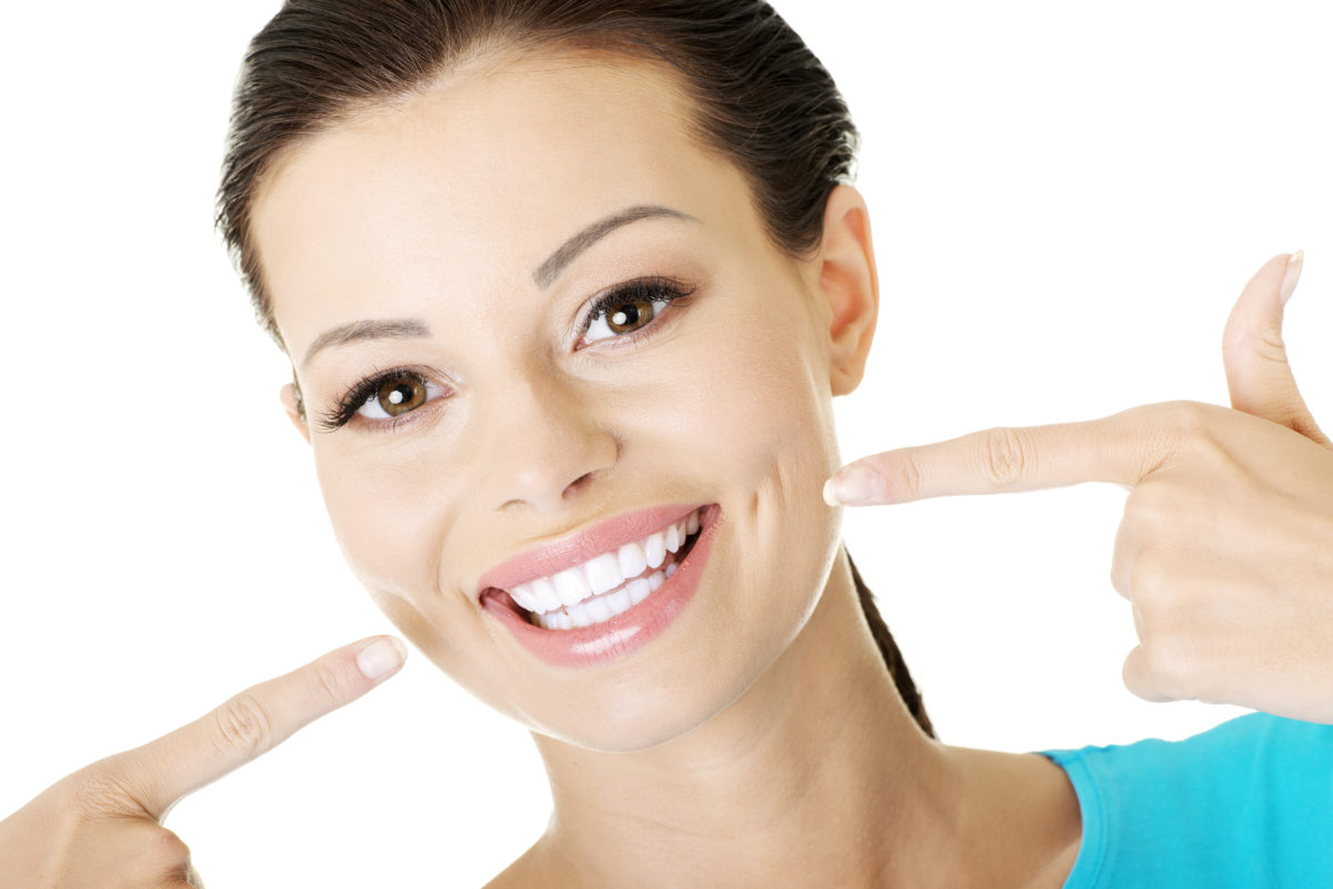 A woman showing her teeth to the camera.