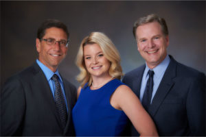 Dr. Pale, Dr. Gemmi, and Dr. Middleburg posing for a photo