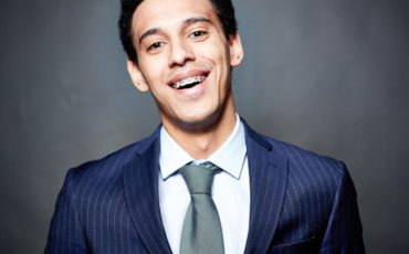 A young man in a suit and tie.